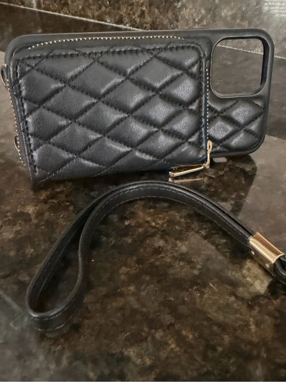 Quilted Black Wallet Phone Case with Gold detail.
